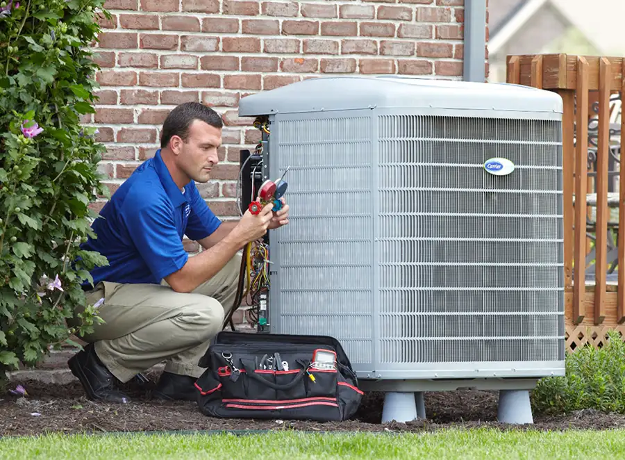 HVAC technician inspecting an outdoor air conditioning unit in North Salt Lake